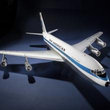 A model of an jet airliner with a long blue stripe down the side. Text above the stripe reads "Pan American."