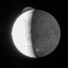 A grey sphere with a plume coming from the top. 