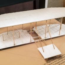 Wood and tissue exhibit model of the 1901 Wright glider in overall natural color scheme. 1/16 scale.