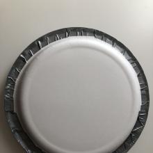 Two plates facing each other taped together with duct tape. 