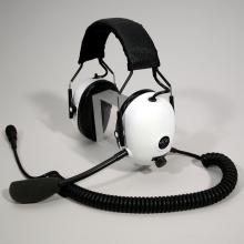 Headphones with white earmuffs and a microphone.