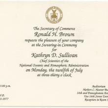 Invitation with Department of Commerce seal at the top. Text: The Secretary of Commerce Ronald H. Brown requests the pleasure of your company at the swearing in ceremony for Kathryn D. Sullivan Chief Scientist of the National Oceanic and Atmospheric Administration on Monday the twelfth of July at three thirty o clock.  Arrive by 3pm. Auditorium Herbert C. Hoover Building.