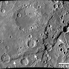 A surface of Mercury with craters.