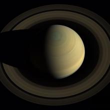 A three-fourths view of Saturn looking down from the top.