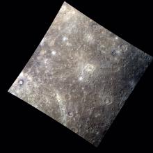 An image of Mercury's surface featuring difference shades of browns and grays.