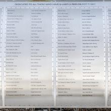 Silver metal plaque listing Wall of Honor Honorees.