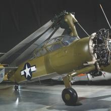 An olive green autogiro with the Air Force symbol on the side. 