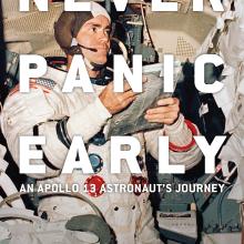 Never Panic Early Book cover by Fred Haise depicting a single astronaut with the book tile superimposed