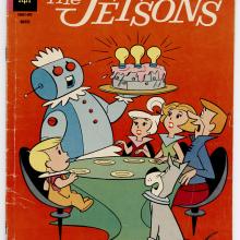 A red comic book cover showing a family gathered round a table, with a robot bringing a metallic cake to the family. 