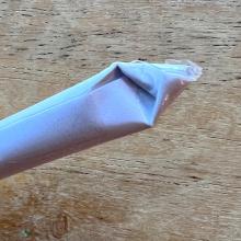 A rolled rod of paper with a pinched pointed end.