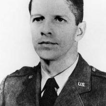 A photographic portrait of a man dressed in Air Force garb.