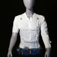 Mannequin wearing a white leotard and belt.