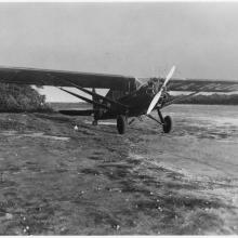 Three-quarter right front view of a propeller-driven airplane