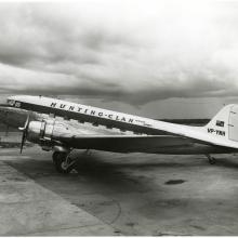 Left side view of a propeller-driven aircraft with the livery of Hunting Clan Airlines.