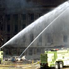 Foam 331 and Foam 335 from Ronald Reagan Washington National Airport’s Station 301 spray water on the impact site after expending their foam.