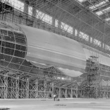 A view of Shenandoah from the side inside its hangar as it receives its outer layer of fabric.