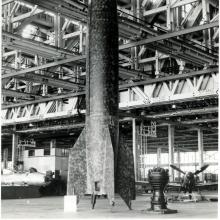 Large rocket in an empty facility.