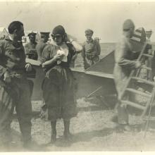 Leon (left) and an unidentified woman chat after a flight, undated.