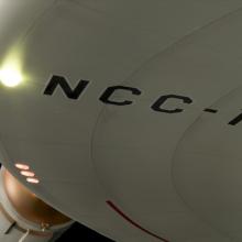 NCC-17 can be seen in black block letters on the bottom of the starship's disk. 