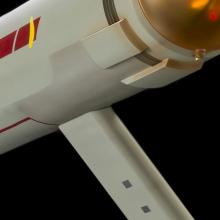 A close up image that shows rectangular shapes on the bottom of an arm that extends from the starship. 