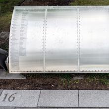 Names written on silver metal panel outside Hazy center.