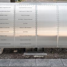 Silver metal plaque listing Wall of Honor Honorees.