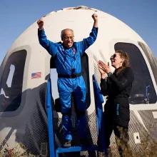 Ed Dwight exits the New Shepard capsule after completing his flight to space.