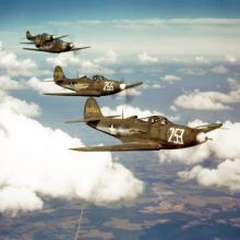 four aircraft in flight