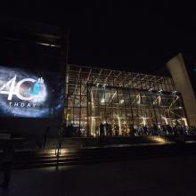 Image of the building with a projection on the exterior. 