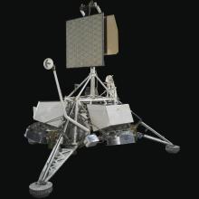 View of a spacecraft with solar panels on top.