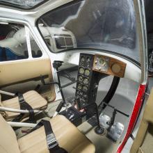 Interior view of a two-seat helicopter. 