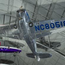 Underbelly of a silver painted plane. 