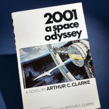 A book titled 2001 A Space Odyssey with a spacecraft on the cover.