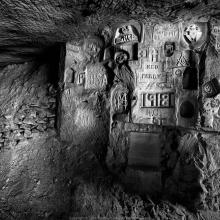 Carvings against stone. 