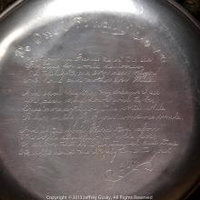 Close up of an engraved mess kit. 