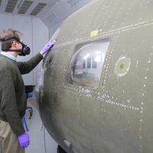 man standing next to flak-bait