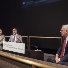 David Rubenstein, chair of the Smithsonian Board of Regents (right), moderates a discussion between Gemini and Apollo Astronaut Michael Collins (left) and Amazon CEO Jeff Bezos (center).