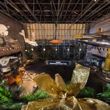 Image of the Museum's entry gallery from the second floor. A rainbow can be seen outside. 