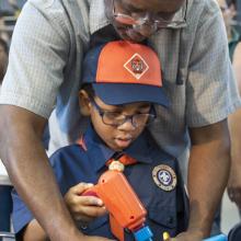 Father and son putting together an airplane model