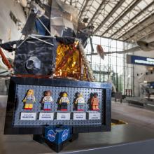 The original prototypes of the LEGO® Ideas "Women of NASA" set displayed in front of the Apollo Lunar Module in the Boeing Milestones of Flight Hall 