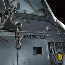 Close up of an oil cap and cargo hook of a helicopter.