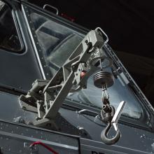 View of a cargo hook attached to a helicopter.