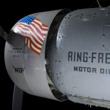 View of an engine and propeller of an airplane. 