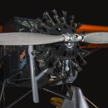 Close up image of a propeller and engine of an airplane. 