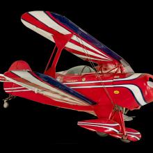 Red, white, and blue painted aerobatic biplane. 