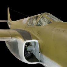 Close up view of the cockpit and intake valve of a jet plane.