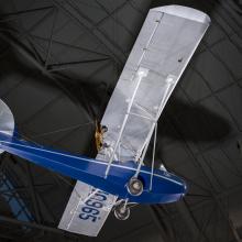 View of a blue painted fuselage on an airplane. 