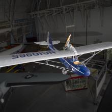 Blue and silver painted aircraft hanging in the museum. 