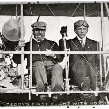 President Theodore Roosevelt (left) and pilot Arch Hoxsey (right) seated in Hoxsey's Wright (Co) Type AB.