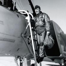 Chuck Yeager stands on ladder outside F-15B